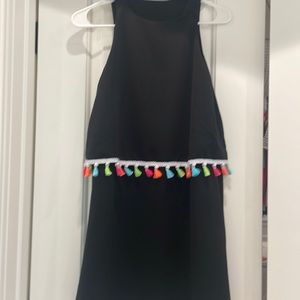Black with colorful detail. No size on it but it fits like a small.